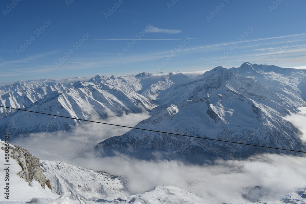 Sunny day on a Hintertux glacier (photo taken from 3250 meters above sea level) with view of Tirol Alps