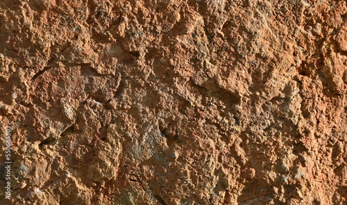 Fondo con detalle y textura de superficie de piedra con acabado rugoso y tonos marrones