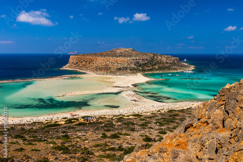 Fantastic panorama of Balos Lagoon and Gramvousa island on Crete  Greece. Cap tigani in the center. Balos beach on Crete island  Greece. Tourists relax and bath in crystal clear water of Balos beach.