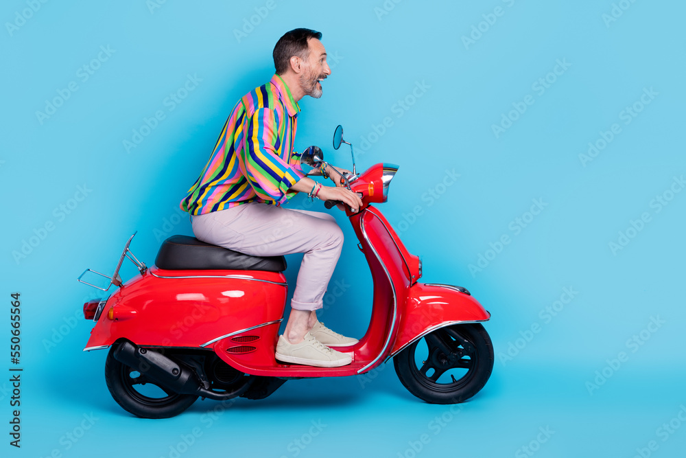 Profile side photo of crazy carefree enjoy trip first drive lesson move city town look empty space isolated on blue color background