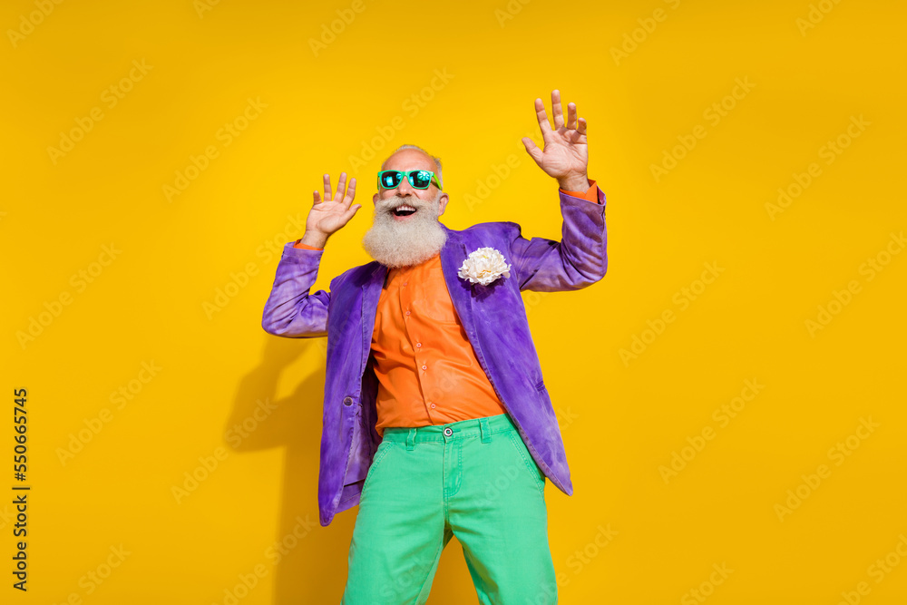 Photo portrait of attractive grandpa nightclub dancer retro vintage festive wear trendy colorful look isolated on yellow color background