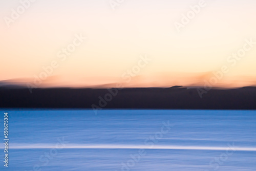 Motion blur sunrise over bay
