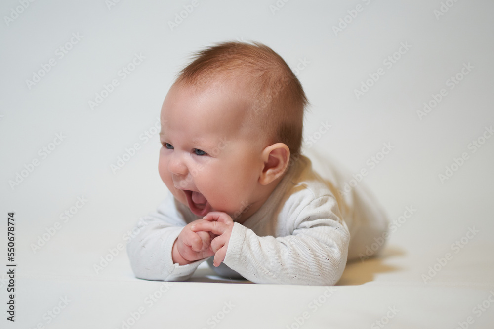 portrait of a smiling baby on a white background portrait of a smiling baby on a white background