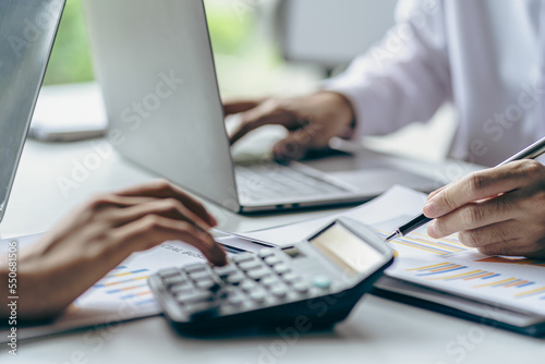 
Businessman working on stock market investment chart with financial data analysis Two business colleagues discussing financial and company planning graphs during budget meeting in office room