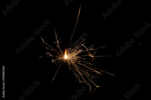 Burning sparklers on a black background