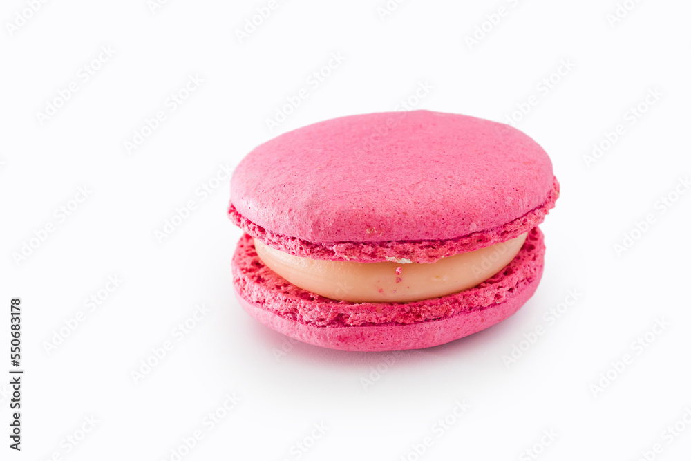 Pink French macaroon isolated on white background. Tasty colourful macaroons. Cookie made of two smooth halves, fastened with stringy fillings. French pastry made from egg whites. Pink French macaroon isolated on white background. Tasty colourful macaroons. Cookie made of two smooth halves, fastened with stringy fillings. French pastry made from egg whites.