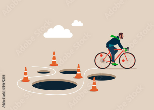 Businessman with Bicycle  pass many pitfalls to achieve business success. Avoid pitfall, adversity and brave to around pass mistake or business failure, skill and creativity to solve problem concept.