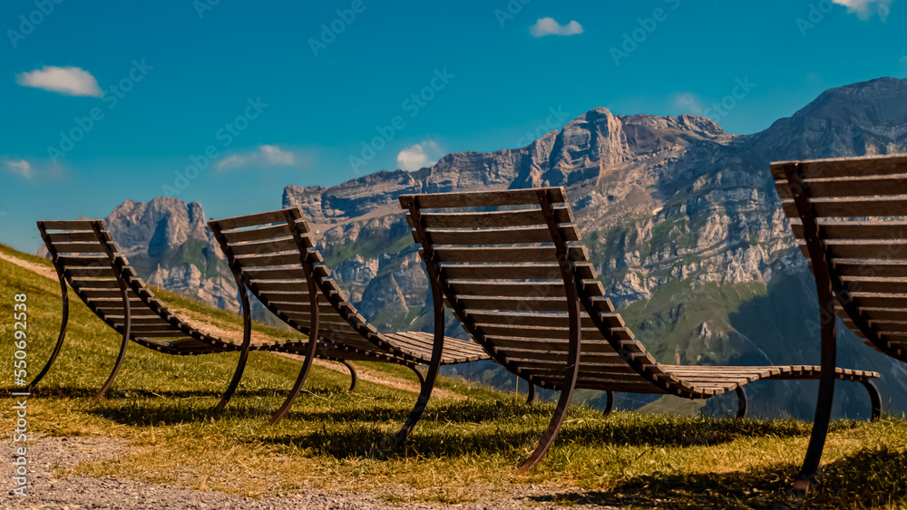 Beautiful alpine summer view with relaxation chairs at the famous Kronberg mountains, Appenzell, Alpstein, Switzerland Beautiful alpine summer view with relaxation chairs at the famous Kronberg mountains, Appenzell, Alpstein, Switzerland