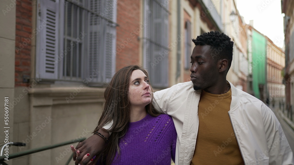 Young romantic interracial couple walking outside in european city2 Young romantic interracial couple walking outside in european city2