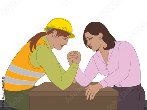 business woman and trades woman arm wrestling on desk isolated on white background