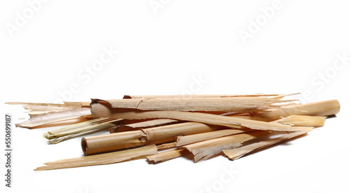 Dry bamboo husks, yellow reed leaves isolated on white 