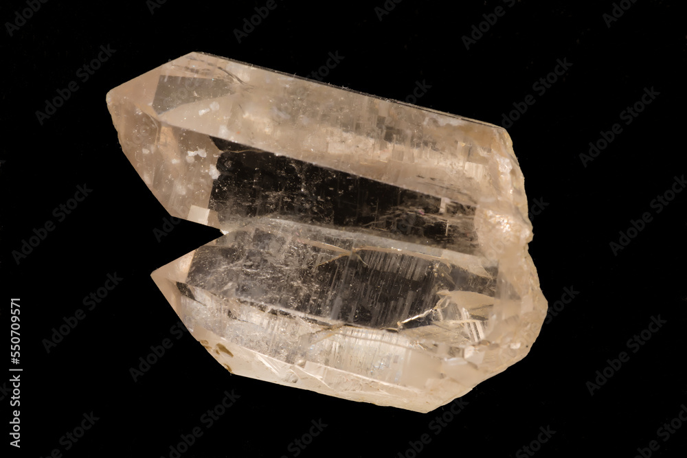 Close-up image of a milky quartz crystal on a black background Close-up image of a milky quartz crystal on a black background