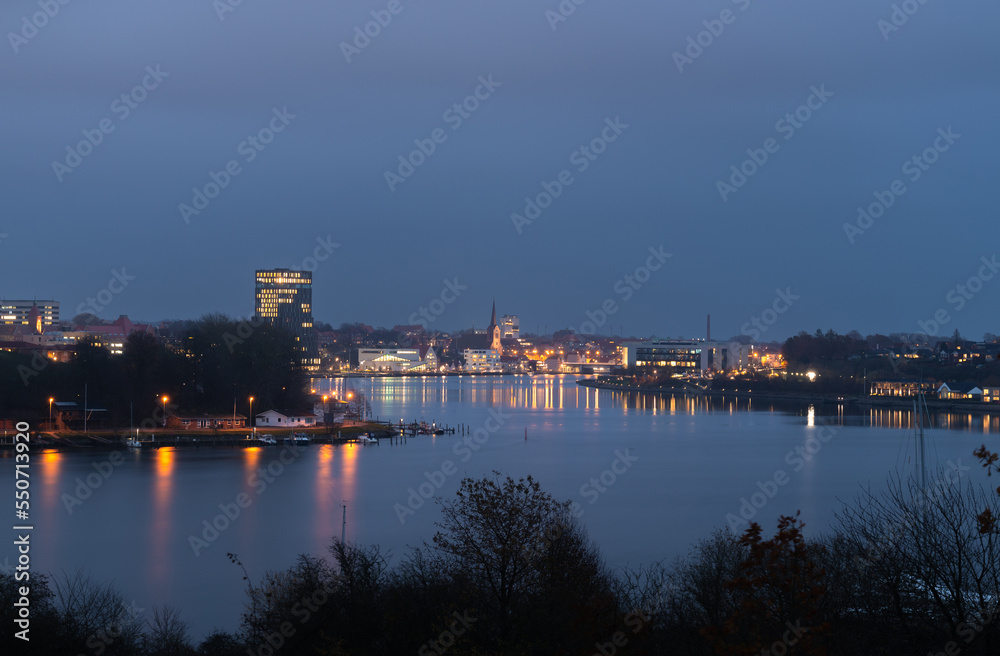 Evening cityscape of Sonderborg (Dan. Sønderborg), city in Southern Denmark. Night skyline city lights panorama