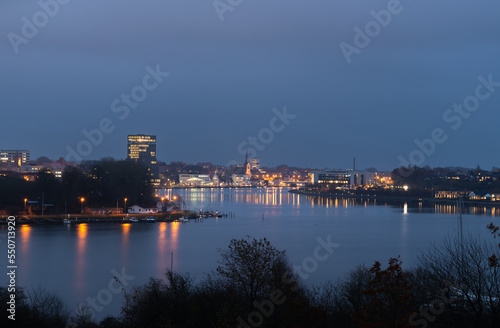 Evening cityscape of Sonderborg  Dan. S  nderborg   city in Southern Denmark. Night skyline city lights panorama