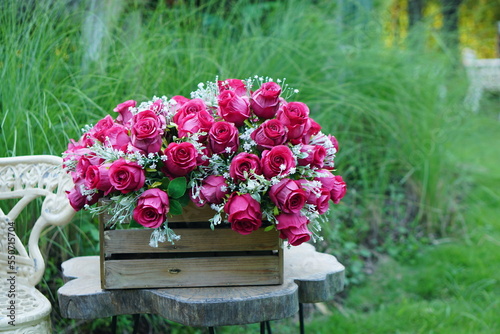 Fototapeta Naklejka Na Ścianę i Meble -  Beautiful colorful roses on the table for the festive New Year 2023
