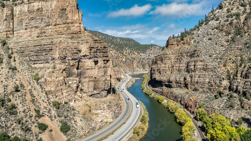 Interstate 70 (I-70) beside the Colorado River in the Rocky Mountains of Colorado in autumn - Glenwood Canyon photo