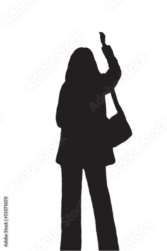 Black silhouette of a female figure writing or drawing on a wall