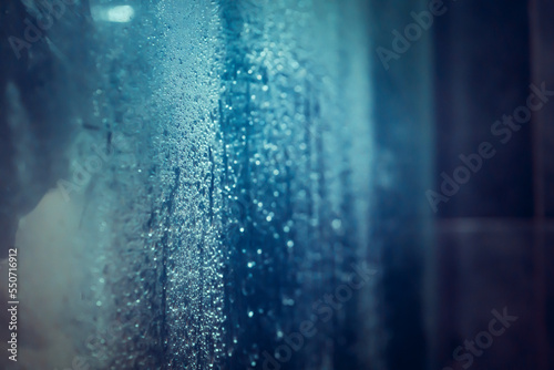 Drops of water on the glass closeup view.