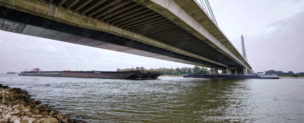 Naklejka premium Waal river boats transporting goods