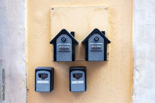 Outdoor apartment Safe Key Box home rent To Retrieve Keys in wall entrance door rental.