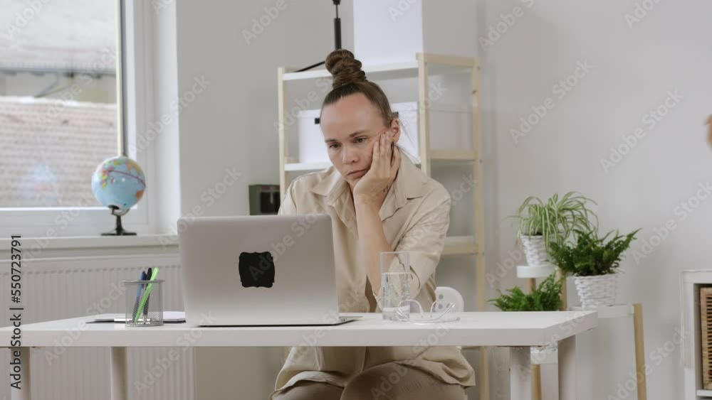 Young mother is working at laptop. Homeoffice Young mother is working at laptop. Homeoffice