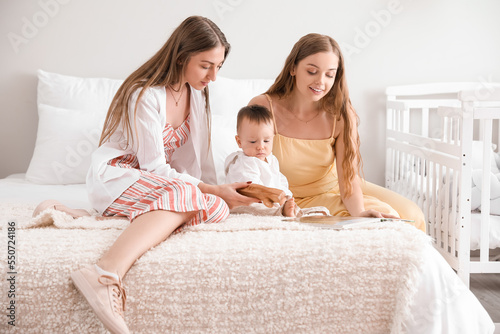 Happy lesbian couple with t...