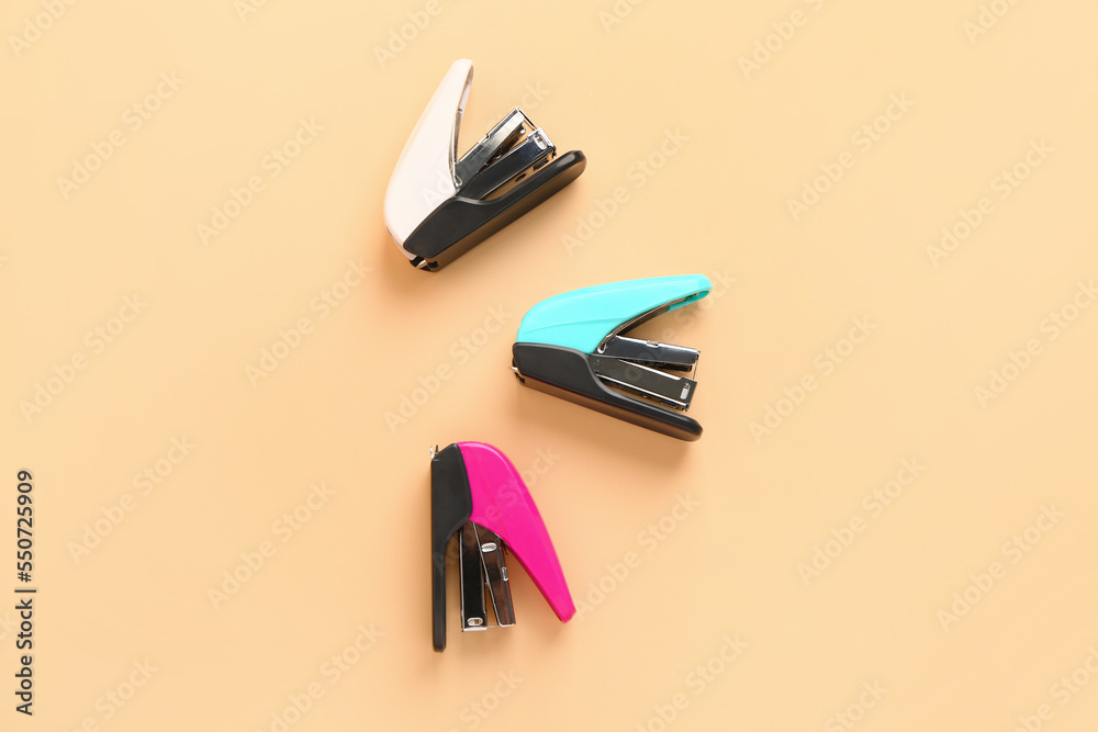 Different office staplers on color background Different office staplers on color background