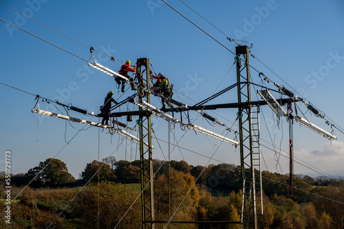 High voltage transmission tower, power line modernization, high-rise work on the power transmission line