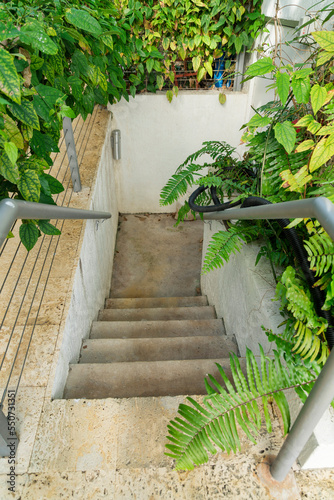 Fototapeta Naklejka Na Ścianę i Meble -  Concrete stairway with landing and handrails view from above at Miami, Florida