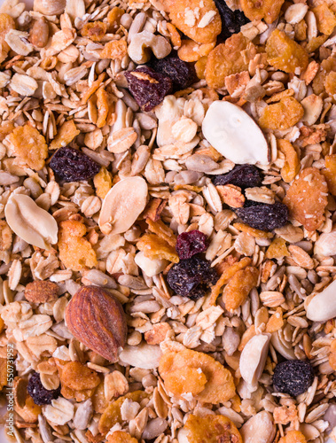 Granola with nuts, goji berries, seeds, peanuts, almonds, raisins and cereal. Healthy food concept