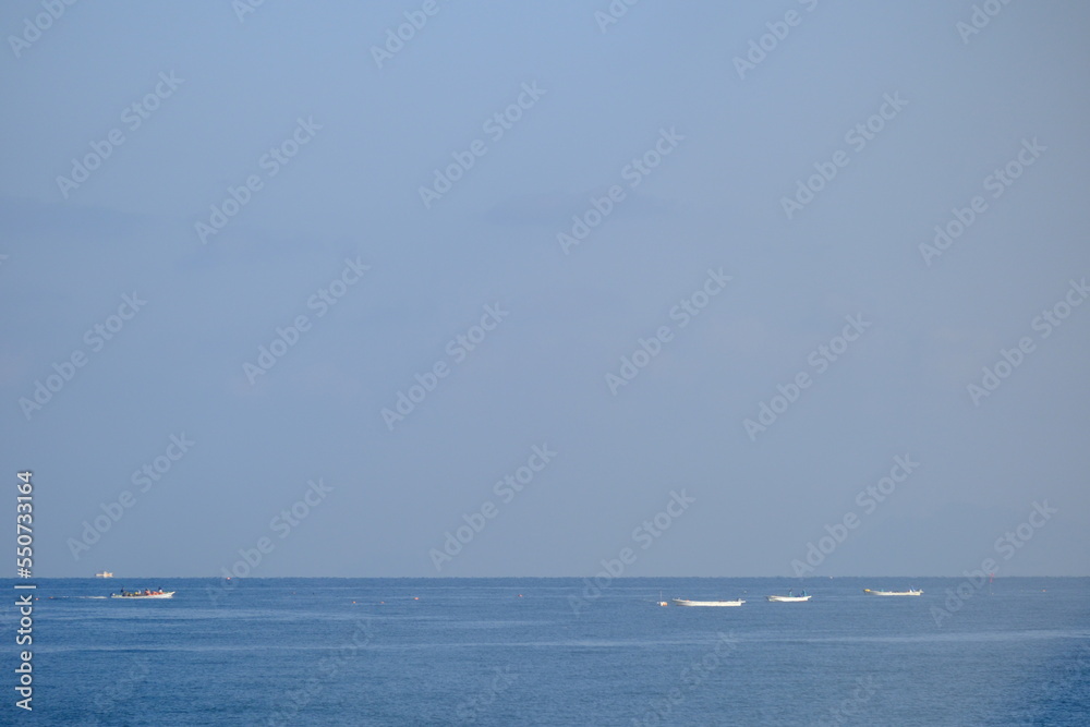 People fishing on a fishing boat on a sunny day in the Seto Inland Sea