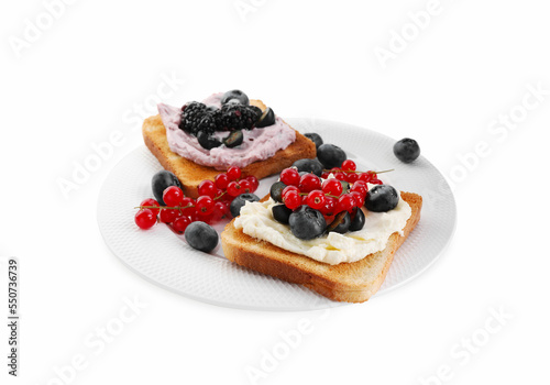 Tasty sandwiches with cream cheese  blueberries  red currants and blackberries on white background