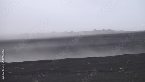 Bands of fog creep over the volcanic plateau, which is covered with volcanic slag, scoria. Kamchatka photo