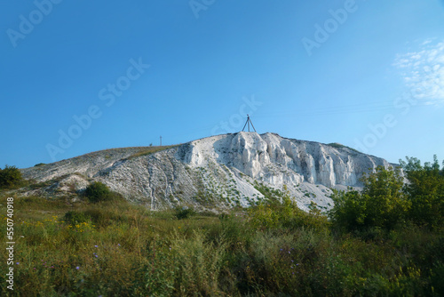 Ancient multimillion chalk mountains on the steppe surface of earth. White chalk mountains in the Dvurechansky park reserve in Ukraine photo