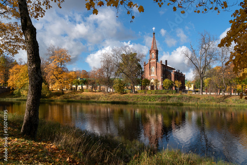 View of the Lutheran Church of the Resurrection of Christ in Tsarskoye Selo on the bank of the 4th Lower Pond on a sunny autumn day, Pushkin, St. Petersburg, Russia