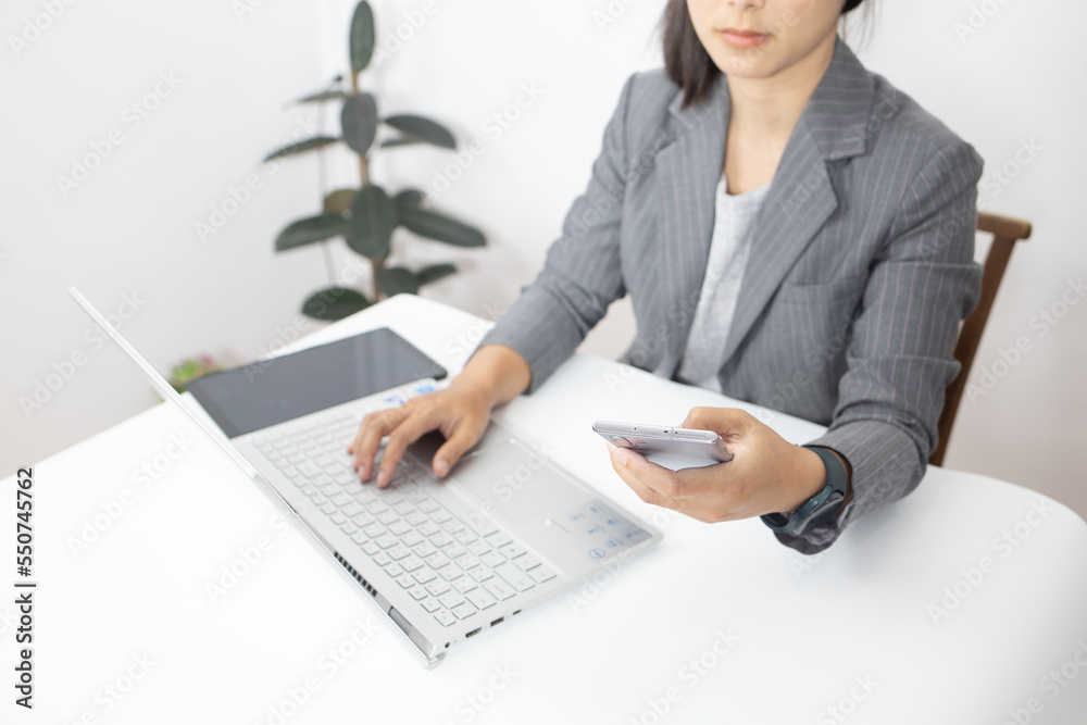 business woman looking the laptop or Notebook computer, personal working with laptop in the home office. business woman looking the laptop or Notebook computer, personal working with laptop in the home office.