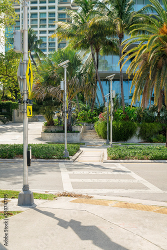 Obraz na plátne Crosswalk with yellow signs on the post at the side in Miami, Florida