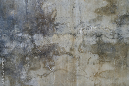 The cement flap surface has scratches  black and white stains  traces caused by plastering to create an artistic pattern