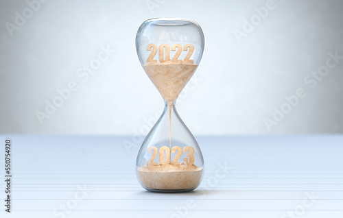 New Year 2023, The time of 2022 is running out in the hourglass.