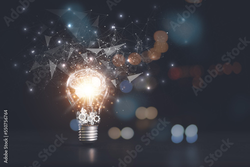 the light bulb is on the table,for Concept new idea, concept with innovation and inspiration, innovative technology in science concept and modern business development,creative idea.