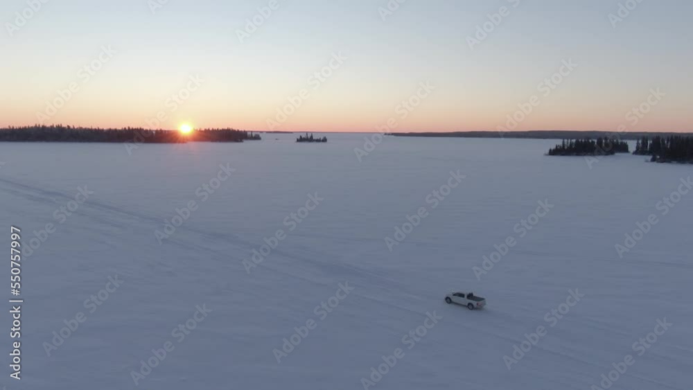 Truck driving across a frozen lake tundra, Wide Truck driving across a frozen lake tundra, Wide