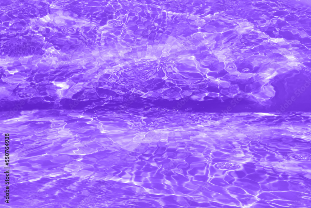 Defocus blurred transparent purple colored clear calm water surface texture with splashes and bubbles. Trendy abstract nature background. Water waves in sunlight with copy space. Pink watercolor shine