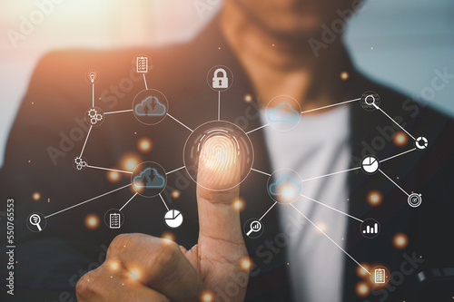 Business man scanning his finger when accessing the technological information system