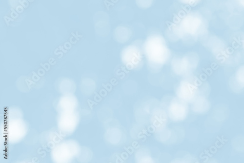 Abstract light blue blur bokeh for background, light blur on high light blue gradient abstract background in central design for presentation.