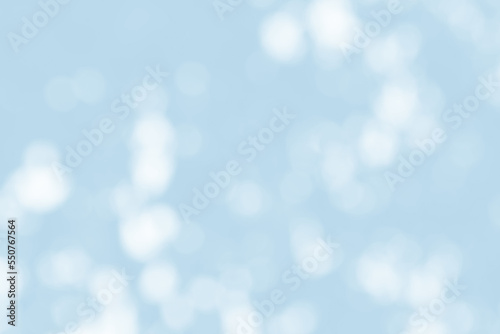 Abstract light blue blur bokeh for background, light blur on high light blue gradient abstract background in central design for presentation.