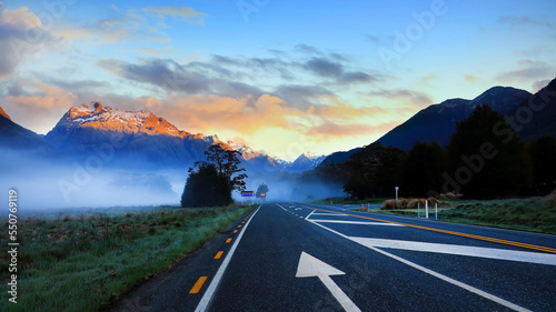 The Road trip view of travel with mountain view of autumn scene and foggy in the morning with sunrise sky scene at fiordland national park