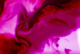 Bright flowing alcohol Ink on toning in Viva Magenta background. Acrylic Fluid Art. Liquid marble texture for abstract artwork. Trendy creative design in color of 2023. High quality photo