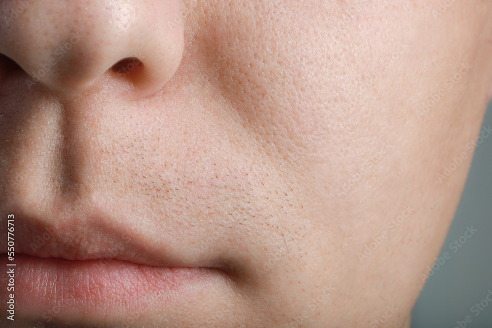 Closeup view of man with healthy skin on light grey background Closeup view of man with healthy skin on light grey background