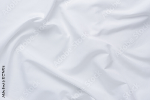 White fabric. luxurious white fabric texture background. Creases of satin, silk and cotton.