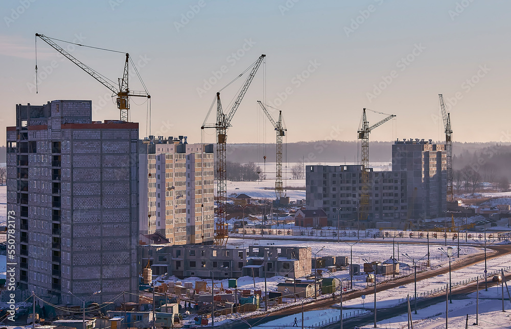 structural steel beam builds large residential buildings on the construction site.